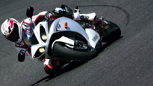 A 2009 Yamaha R1 being ridden around a track